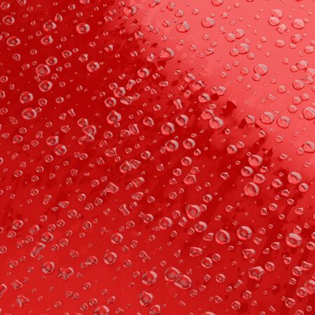 Quadratic image of a drop of water on a flat red surfaceの写真素材