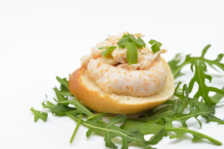 Sandwich with Fish Roe Salad on Rucola Leaves, Isolated on White Backgroundの写真素材