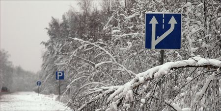 Traffic signs. / on a roadside of winter road dark blue traffic signs.の写真素材