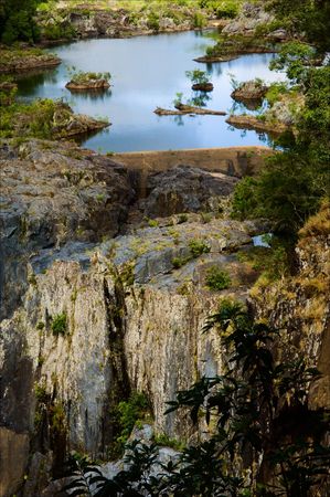 On stony rocks small lake from which the stream follows.の写真素材