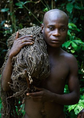 Africa. Jungle of the Central-African Republic. On November, 2nd, 2008. The hunter-pygmy with a net. The hunter-pygmy with a net before hunting.のeditorial素材