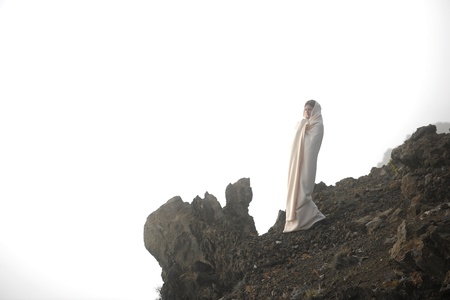 The girl shrouded in a cloud, it is high in mountains, early in the morning.の写真素材