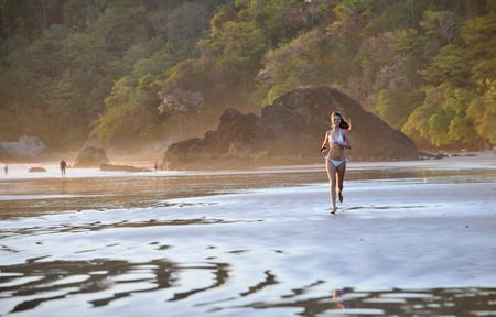 Young beautiful on a beach. One. Coast Pacific of ocean in Costa Rica.の写真素材