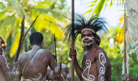 INDONESIA, IRIAN JAYA, ASMAT PROVINCE, JOW VILLAGE - JUNY 28: The Portrait Asmat warrior with a traditional painting and coloring on a face. June 28, 2012 in Jow Village, Asmat province, Indonesiaのeditorial素材