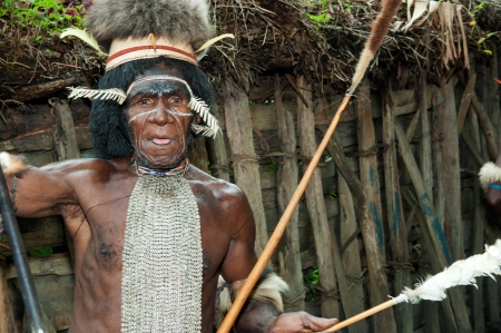 DUGUM DANI VILLAGE,  IRIAN JAYA PROVINCE, NEW GUINEA, INDONESIA - JUNE 20: Dugum Dani Warrior  with a traditional painting on a face. June 20, 2012 in Dugum Dani The Baliem Valley Papua or Irian Jaya Indonesian New Guineaのeditorial素材