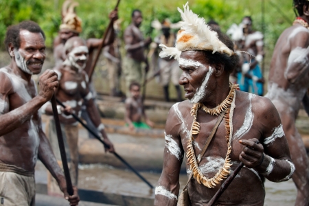 JOW VILLAGE, ASMAT DISTRICT, IRIAN JAYA PROVINCE, NEW GUINEA, INDONESIA - JUNE 28: Group of Asmat...