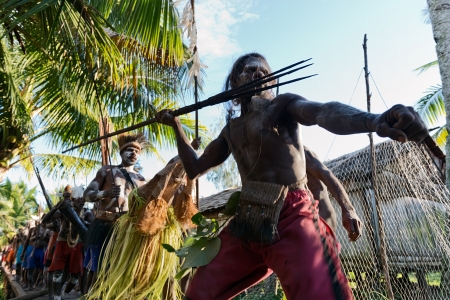  JOW VILLAGE, ASMAT DISTRICT, IRIAN JAYA, NEW GUINEA, INDONESIA - JUNE 28: The Village follows the ancestors embodied in spirit mask as they tour  the village the Doroe ceremony. June 28, 2012 in Jow Village, Asmat, Irian Jaya province, Indonesia のeditorial素材