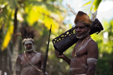 INDONESIA, IRIAN JAYA, ASMAT PROVINCE, JOW VILLAGE - JUNY 28: Portrait of Asmat tribesman with drum  in  Jow Village of the region Asmat. New Guinea Island, Indonesia. June 28 2012のeditorial素材