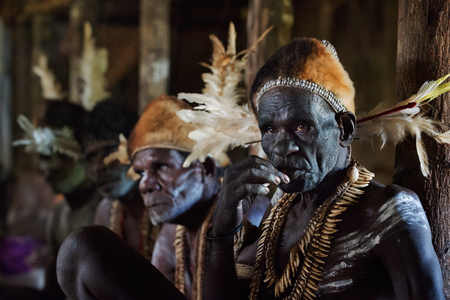 JOW VILLAGE, IRIAN JAYA PROVINCE, NEW GUINEA, INDONESIA - JUNE 28  The Portrait Asmat warrior with a traditional painting and coloring on a face June 28, 2012 in Jow Village, Asmat province, Indonesiaのeditorial素材