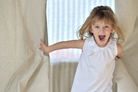 Happy smiling little girl on white backgroundの写真素材