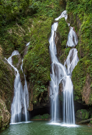 Sendero Vegas Grande waterfall. Waterfall in a lush rainforest. Vegas grande waterfall in Topes de Collante, Trinidad, Cubaの写真素材