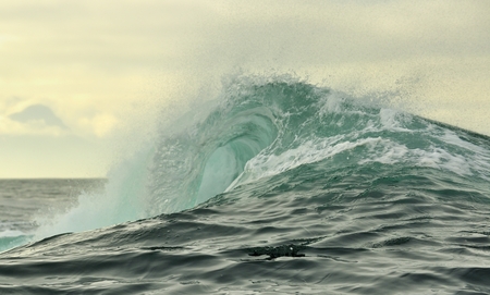Powerful ocean wave breaking. Wave on the surface of the ocean. Wave breaks on a shallow bank....