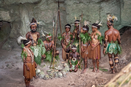 NEW GUINEA, INDONESIA - 2 FEBRUARY: Papuans with bones and skulls. The people of a Papuan tribe of Yafi in traditional clothes, ornaments and coloring. New Guinea Island, Indonesia. February 2, 2009.のeditorial素材