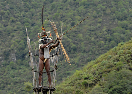 DANI VILLAGE, WAMENA, IRIAN JAYA, NEW GUINEA, INDONESIA,  25 JULY 2009: Yali Mabel, the chief of Dani tribe on the observation tower. July 2009,  The Baliem Valley, Indonesian, New Guineaのeditorial素材
