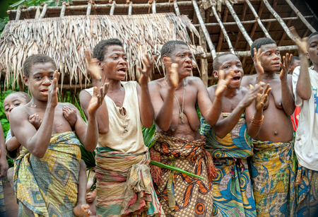DZANGA-SANHA FOREST RESERVE, CENTRAL-AFRICAN REPUBLIC (CAR), AFRICA, 2008 NOVEMBER 2: People from a tribe of Baka pygmies in village of ethnic singing. Traditional dance and music. Nov, 2, 2008 CARのeditorial素材