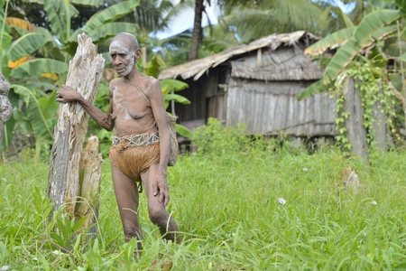 YOUW VILLAGE, ATSY DISTRICT, ASMAT, NEW GUINEA, INDONESIA - MAY 23: Portrait of an elderly papuan woman from the tribe of Asmat. Small village on the deep jungle of New Guinea. Indonesia. May 23, 2016のeditorial素材