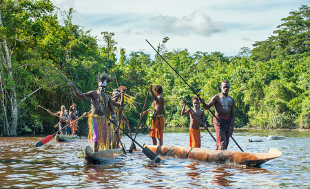 INDONESIA, IRIAN JAYA, ASMAT PROVINCE, JOW VILLAGE - JUNE 23: Canoe war ceremony of Asmat people. Headhunters of a tribe of Asmat . New Guinea Island, Indonesia. June 23, 2016のeditorial素材