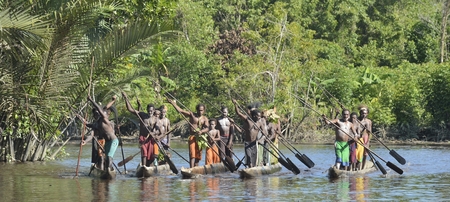 INDONESIA, IRIAN JAYA, ASMAT PROVINCE, JOW VILLAGE - JUNE 23: Canoe war ceremony of Asmat people. Headhunters of a tribe of Asmat . New Guinea Island, Indonesia. June 23, 2016のeditorial素材