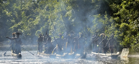 INDONESIA, IRIAN JAYA, ASMAT PROVINCE, JOW VILLAGE - JUNE 23: Canoe war ceremony of Asmat people. Headhunters of a tribe of Asmat . New Guinea Island, Indonesia. June 23, 2016のeditorial素材