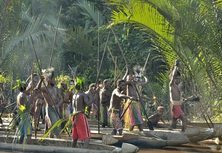 INDONESIA, IRIAN JAYA, ASMAT PROVINCE, JOW VILLAGE - JUNE 23: Canoe war ceremony of Asmat people....