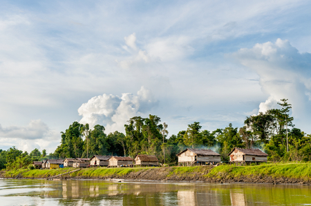 Wooden traditional house on the coast of the river Sitak Mitaka people. Papua Province, Mappi regency, Citak-Mitak subdistrict, south coast, east of the confluence of the Eilanden and Wilderman riversのeditorial素材