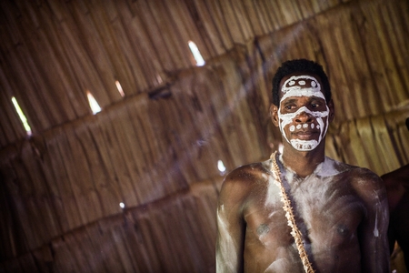 YOUW VILLAGE, ATSY DISTRICT, ASMAT REGION, IRIAN JAYA, NEW GUINEA, INDONESIA - MAY 23, 2016: Portrait of a man from the tribe of Asmat people in the ritual face painting.  New Guinea. May 23, 2016のeditorial素材