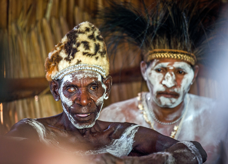 YOUW VILLAGE, ATSY DISTRICT, ASMAT REGION, IRIAN JAYA, NEW GUINEA, INDONESIA - MAY 23, 2016: Portrait of a man from the tribe of Asmat people with ritual face painting on Asmat Welcoming ceremonyのeditorial素材