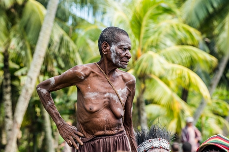 YOUW VILLAGE, ATSY DISTRICT, ASMAT, NEW GUINEA, INDONESIA - MAY 23: Portrait of Papuan woman from Asmat tribe in small village on the deep jungle of New Guinea. Irian Jaya. Indonesia. May 23, 2016のeditorial素材