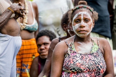 YOUW VILLAGE, ATSY DISTRICT, ASMAT, NEW GUINEA, INDONESIA - MAY 23: Portrait of Papuan women from Asmat tribe in small village on the deep jungle of New Guinea. Irian Jaya. Indonesia. May 23, 2016のeditorial素材