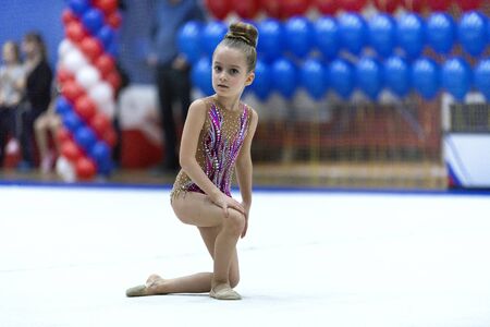 Adorable sporty little girl in rhythmic gymnastics.の写真素材