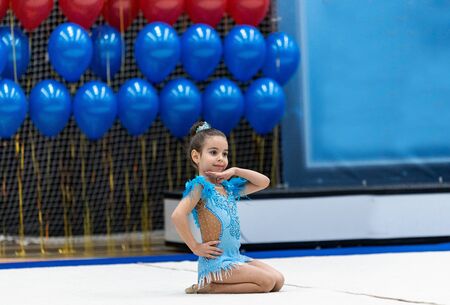 Adorable sporty little girl in rhythmic gymnastics.の写真素材