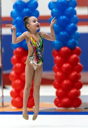 Adorable sporty little girl in rhythmic gymnastics.の写真素材