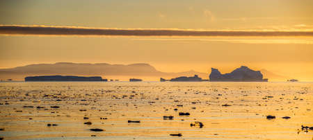 Icebergs at Sunset. Disco Bay, Western Greenland.の写真素材