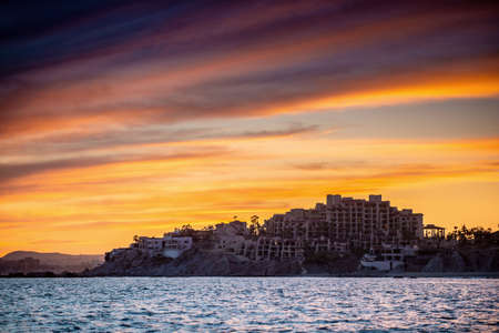 Beautiful Sunset of Seascape with Mountains silhouettes. Sea off the Coast of Cabo San Lucas. Gulf of California (also known as the Sea of Cortez, Sea of Cortes. Mexico. Sunset over Cabo San Lucas.の写真素材
