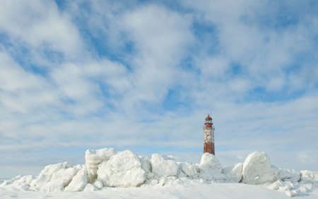 Winter Lighthouse. The Lighthouse island in the winter on the Ladoga Lake. Suho Island. Russia.の写真素材