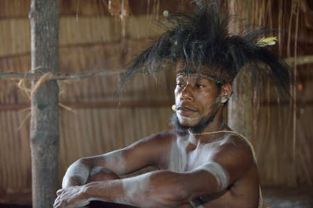 YOUW VILLAGE, ATSY DISTRICT, ASMAT REGION, IRIAN JAYA, NEW GUINEA, INDONESIA - MAY 23, 2016: Close up portrait of a man from the tribe of Asmat. Traditional face painting. New Guinea.May 23, 2016のeditorial素材