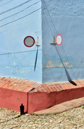 Road sign on l traditional houses in the colonial town of Trinidad in Cubaの写真素材