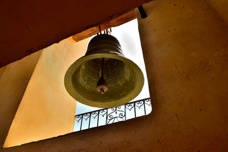 Trinidad de Cuba: Bell in Church or Monastery of Saint Francis which houses the Museum of the Fight against Bandits.Colonial constructions in the background. The town is Unesco World Heritage Siteのeditorial素材