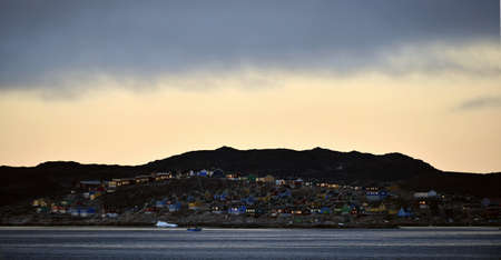 Aasiaat in the evening twilight. Disco bay. West Greenland.