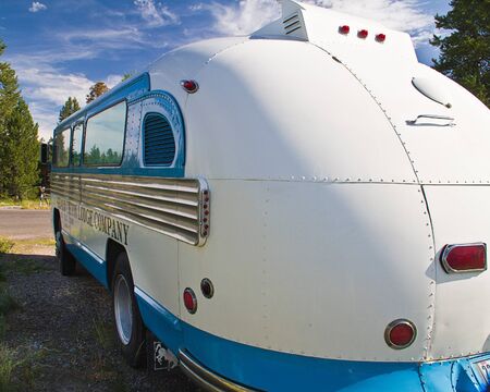 Rear side view of restored Grand Teton Lodge Comapny touring bus.のeditorial素材