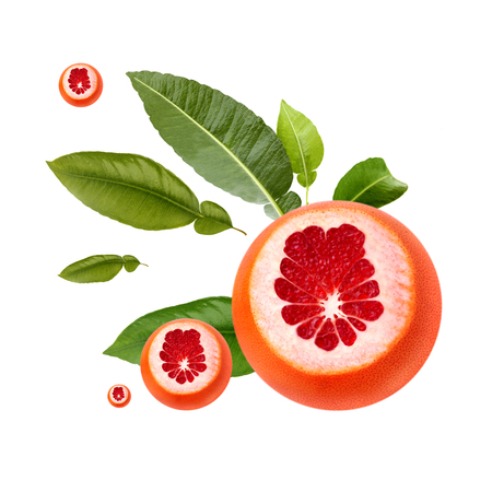 Fresh ripe red grapefruit with green leaves. Red sliced citrus isolated.の写真素材