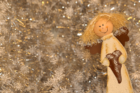 Happy decoration Christmas angel holding a red heartの写真素材