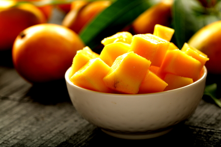 Tasty cold summer salad with mangoes.の写真素材