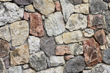 Stonewall of rough stones, natural の写真素材