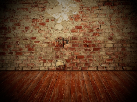 Damaged old brick wall and weathered wooden floor, rustical vintage room design with dark edgesの写真素材