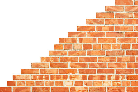 Stepwise increasing brick wall, isolated on white の写真素材