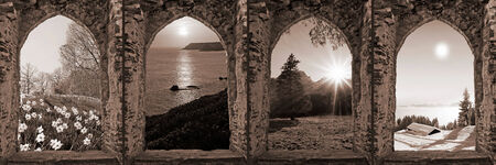 composition of four ruin arched windows with seasonal landscape, retro style の写真素材