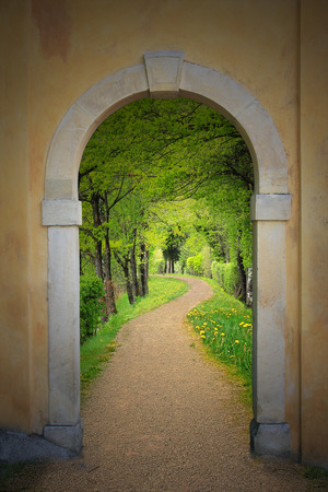 Walkway through arched old door, mystical mood の写真素材