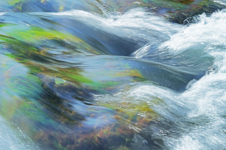 stream rapids in a riverの写真素材