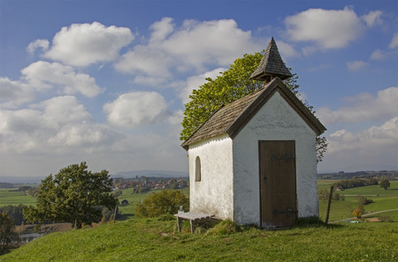 pictorial rural landscape with little chapel at he hill, upper bavariaの写真素材